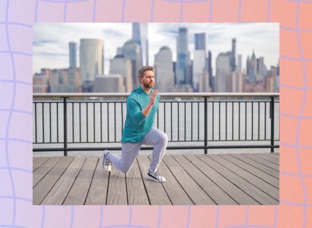 mature man doing lunge exercise outdoors along city waterfront