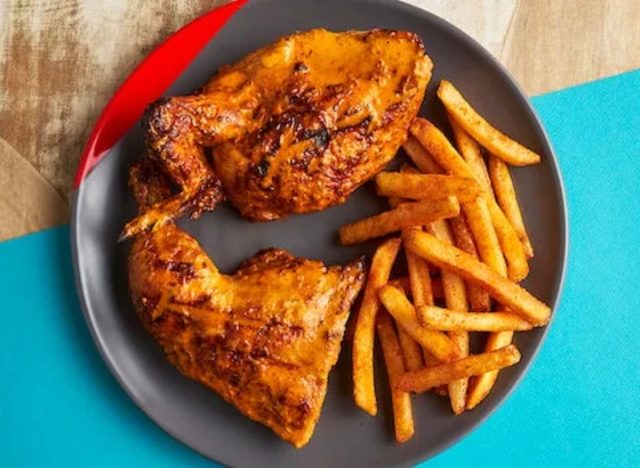 nando's half chicken and chips on a plate