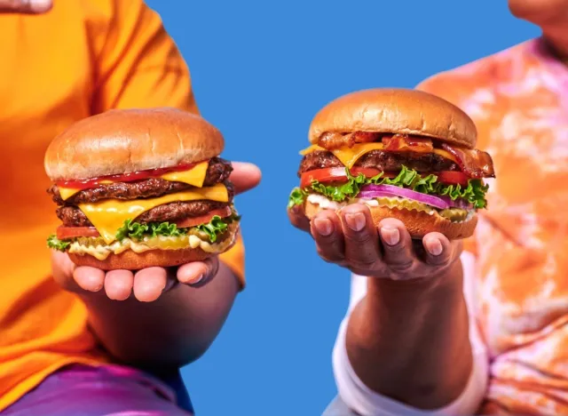 people holding burgerville burgers