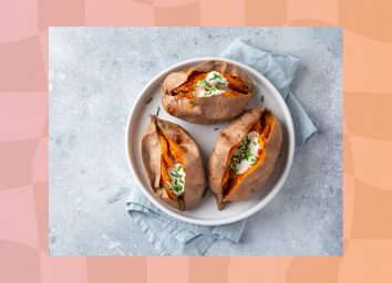 roasted sweet potatoes with sour cream and chives on a plate