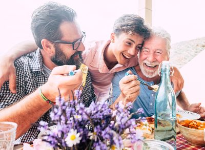 a family eating together enjoying food on father's day