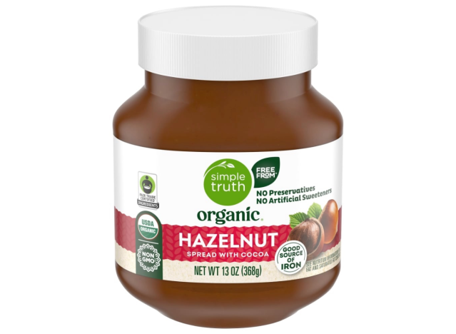 a jar of hazelnut spread on a white background