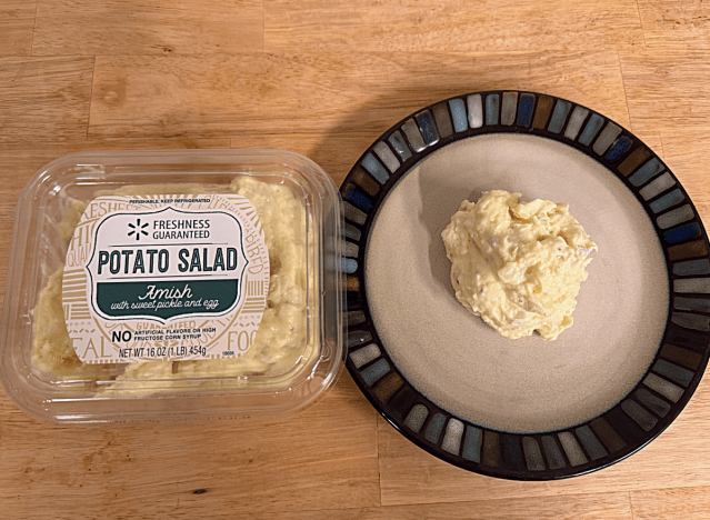 a container of walmart amish potato salad next to a dish of potato salad 