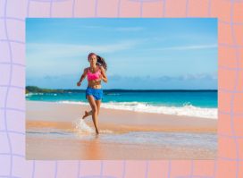 fit woman in pink sports bra and blue gym shorts running on a beach