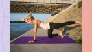 fit blonde woman doing bird dog exercise on purple yoga mat by water and bridge