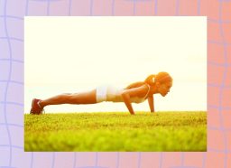 fit woman doing pushups outdoors on sunny day in the grass