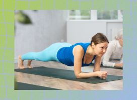 mature woman doing forearm plank on yoga mat in workout class