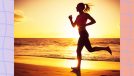 fit woman running on beach at sunset by the water