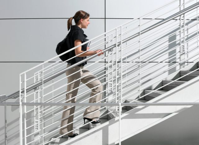 working woman taking the stairs