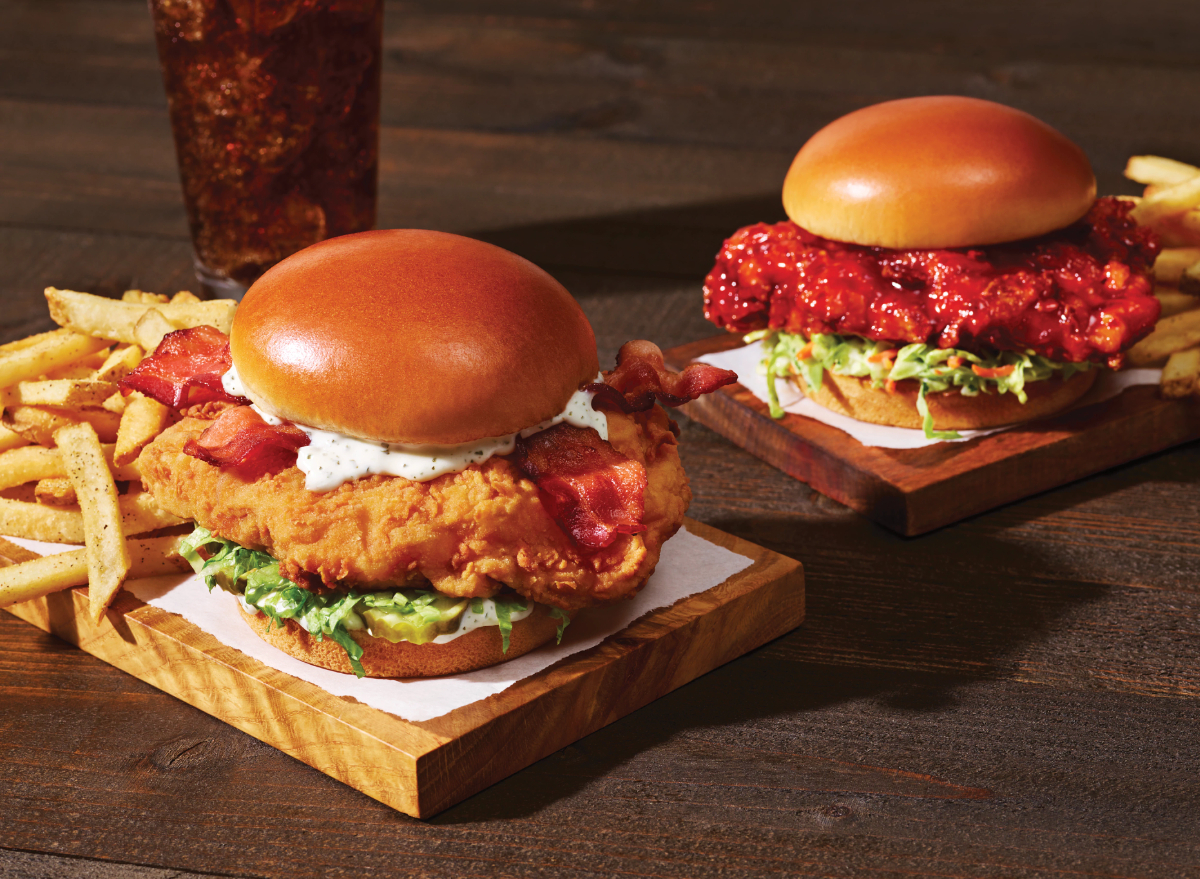 applebee's bacon ranch and sweet and spicy crispy chicken sandwiches with fries and a soda