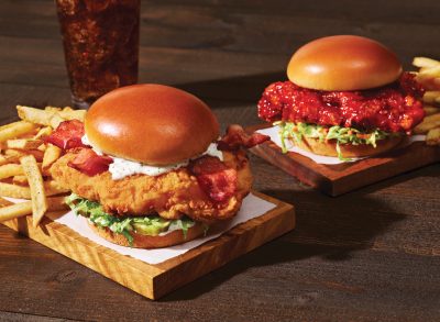 applebee's bacon ranch and sweet and spicy crispy chicken sandwiches with fries and a soda