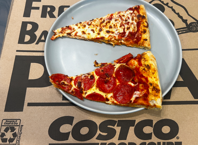 two slices of costco pizza on a box