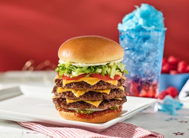 red robin gold medal burger on a plate with star spangled spritzer in the background
