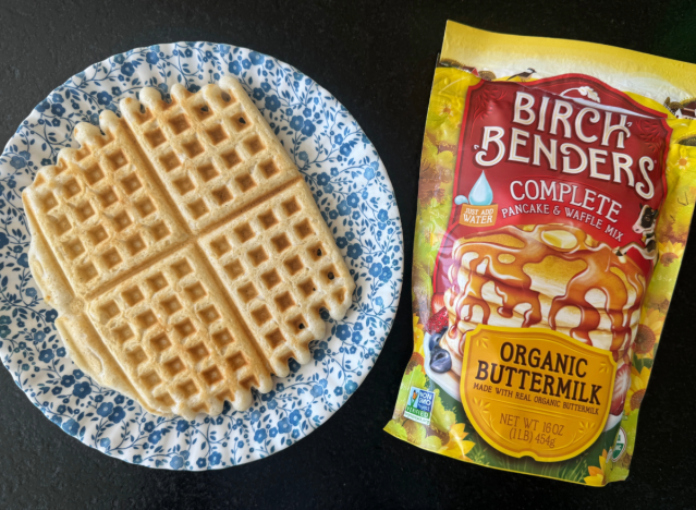 a bag of birch benders waffle mix next to a waffle on a plate 