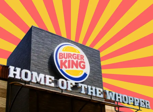 burger king exterior with a red and yellow striped background