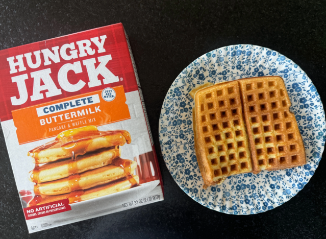 hungry jack mix next to a waffle on a plate 