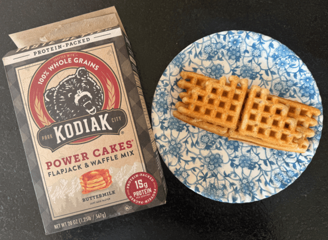a box of kodiak pancake mix next to a plate with a waffle 