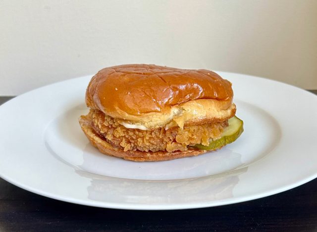 popeyes classic chicken sandwich on a white plate