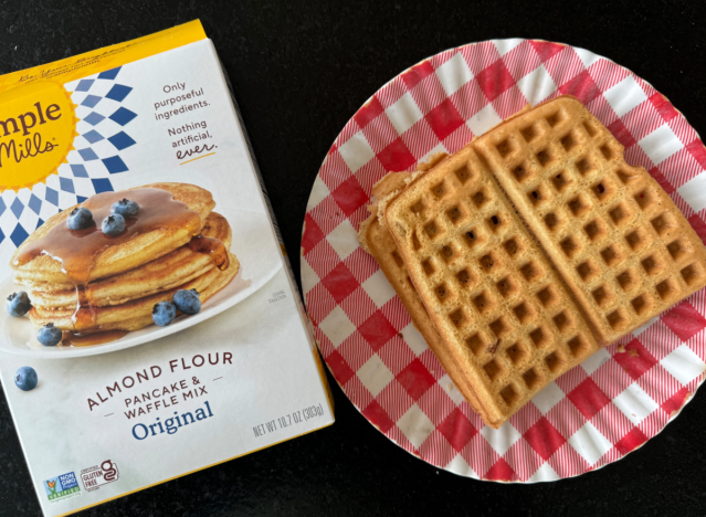 simple mills waffle mix next to a waffle on a plate 