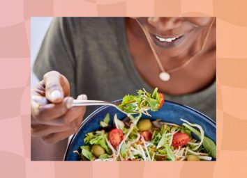 close-up of woman eating salad