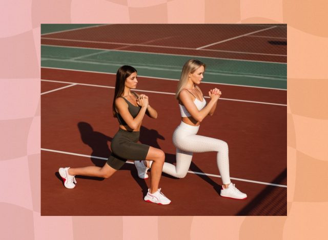 women doing walking lunges on track outdoors