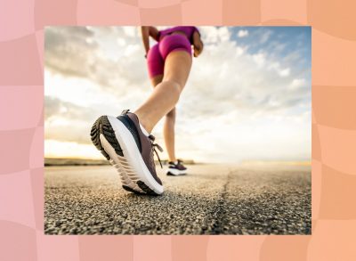 close-up of woman power walking on road on sunny day