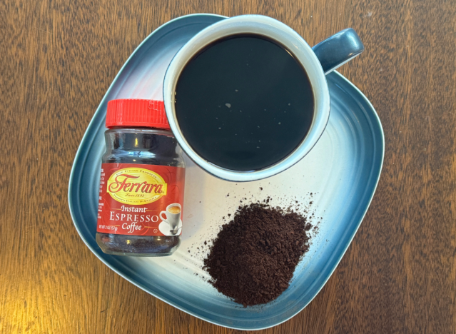 ferrara instant coffee can in mug on plate