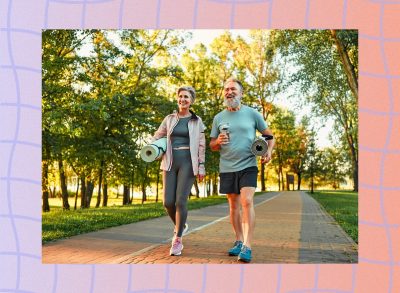happy, mature couple walking in park on sunny day on way to yoga class