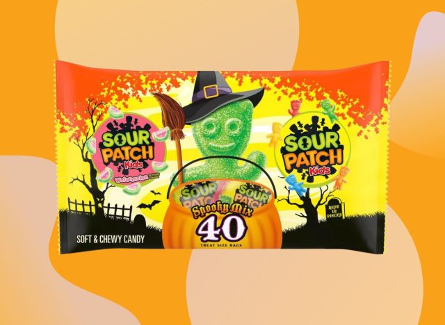 Sour Patch Kids & Sour Patch Watermelon Halloween Candy Variety Pack from Target set against a vibrant orange background