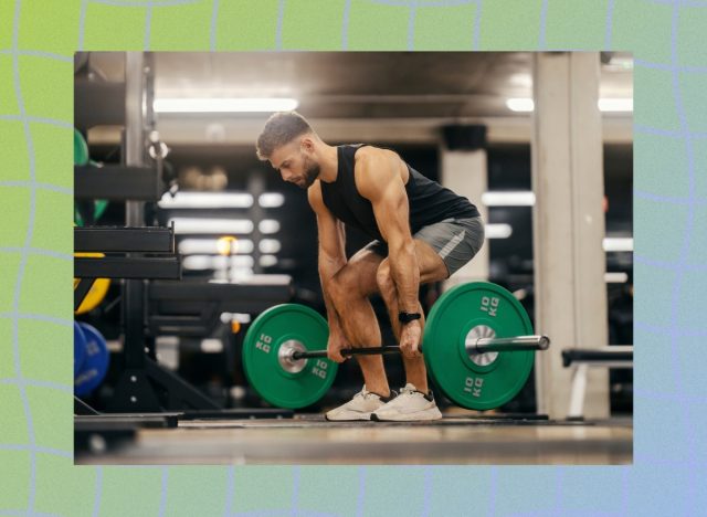 fit, muscular man doing a barbell deadlift in weight room of a gym