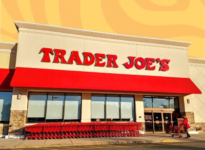 trader joe's storefront set against a colorful background