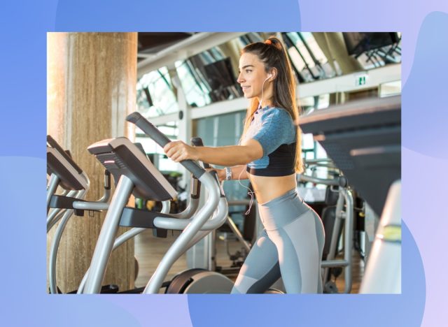 focused brunette woman using elliptical at the gym