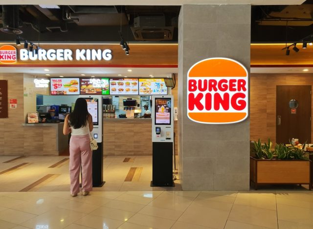 Singapore May 5 2024 customer order food at the self serve panel at Burger King fast food store at kinex mall