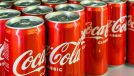 Voronezh - Russia, December 25, 2022: Background from cans with the drink "Coca Cola". (Shallow depth of field)