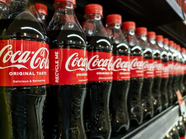Manila, Philippines - Sept 3, 2023: 500 ml PET bottles of regular coca-cola soda for sale at the supermarket.