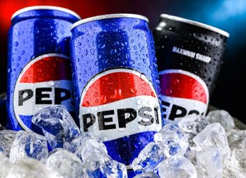 POZNAN, POL - AUG 7, 2024: Cans of Pepsi, a carbonated soft drink produced and manufactured by PepsiCo. The beverage was created and developed in 1893 under the name Brad's Drink