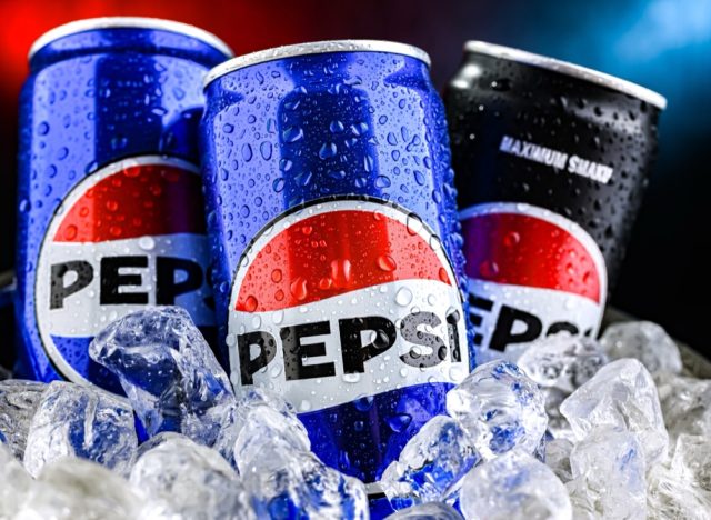 POZNAN, POL - AUG 7, 2024: Cans of Pepsi, a carbonated soft drink produced and manufactured by PepsiCo. The beverage was created and developed in 1893 under the name Brad's Drink