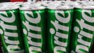 Malang, Indonesia 04-07-2024 : Sprite can in the supermarket. Sprite green can packaging design isolated on supermarket row shelf display background.
