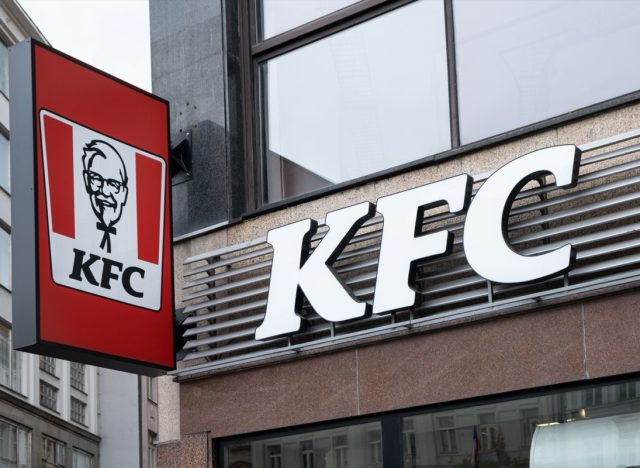 Prague,CZ - 10 October 2023: KFC sign board on restaurant in a historical building in Prague on street. Fast Food concept. EDITORIAL