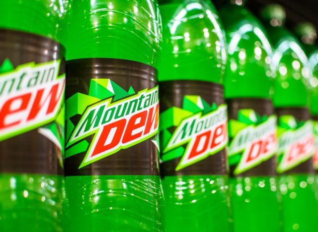 Manila, Philippines - July 2020: A row of Mountain Dew 1.5 Liter soda on display at an aisle in a supermarket.