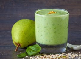 Homemade smoothie made from oats milk, pear, spinach and raw seed