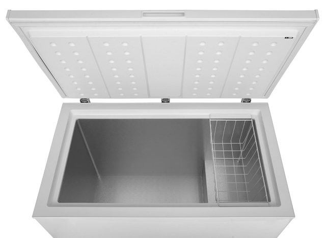 Open freezer on a white background
