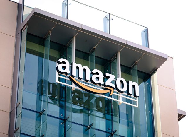 Closeup of Amazon logo on the company office building in Palo Alto, Silicon Valley, San Francisco Bay Area. Amazon sign on glass modern office building wall