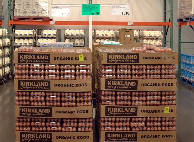 Fresh organic dairy products, eggs and milk bottles refrigerated room in Costco store. Costco Wholesale Corporation is largest membership-only warehouse club in US.