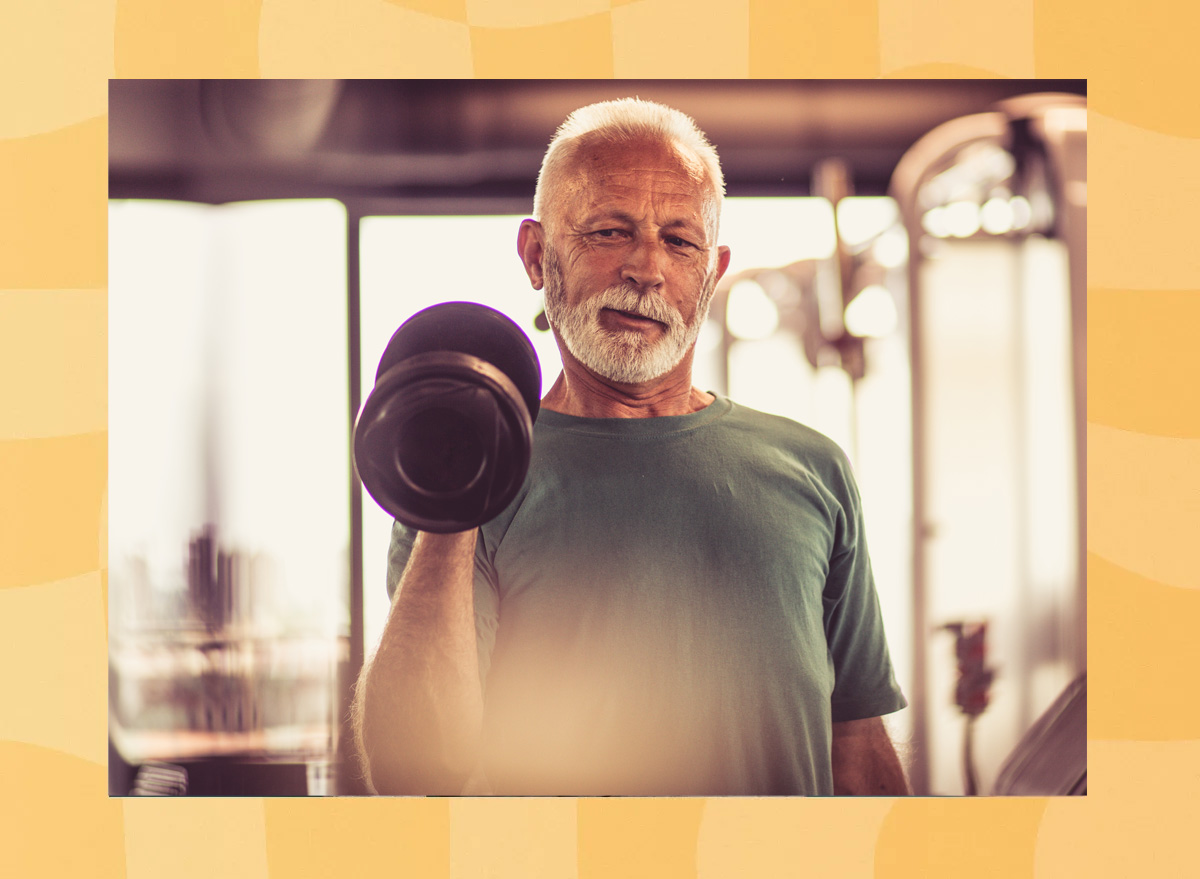 Senior man lifting weights