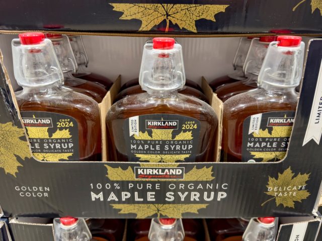 Los Angeles, California, United States - 08-14-2024: A view of several bottles of Kirkland Signature maple syrup, at Costco.