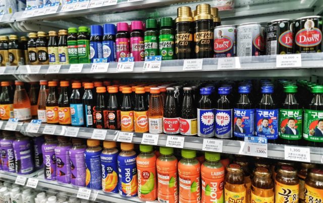 Seoul, South Korea on 7 Nov 2024. A colorful display of Asian energy drinks, protein shakes, and other beverages fills a convenience store shelf, creating a dynamic and inviting scene.