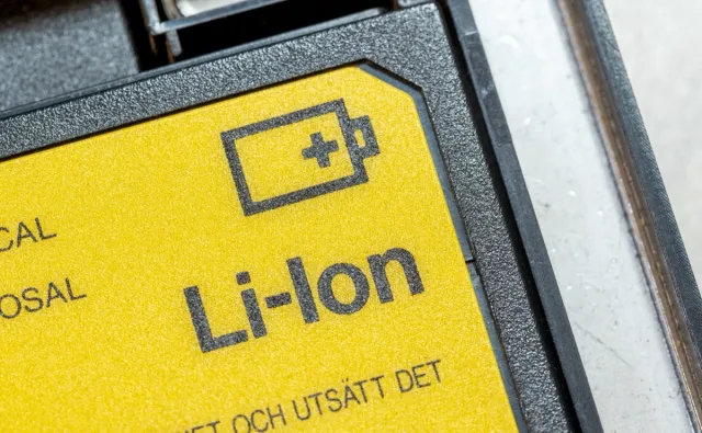 Generic Lithium Ion laptop battery, yellow Li-Ion cell for electronic devices object macro detail, extreme closeup, nobody. Lithium-Ion batteries simple icon symbol abstract concept, care, service