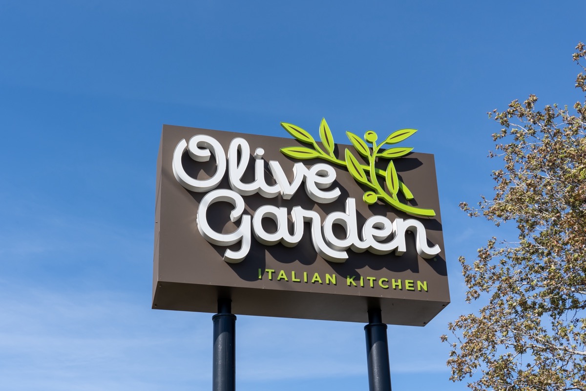Orlando, FL, USA - February 3, 2022: An Olive Garden restaurant pole sign in Orlando, FL, USA. Olive Garden is an American casual dining restaurant chain specializing in Italian-American cuisine.