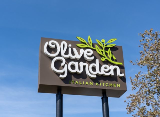 Orlando, FL, USA - February 3, 2022: An Olive Garden restaurant pole sign in Orlando, FL, USA. Olive Garden is an American casual dining restaurant chain specializing in Italian-American cuisine.